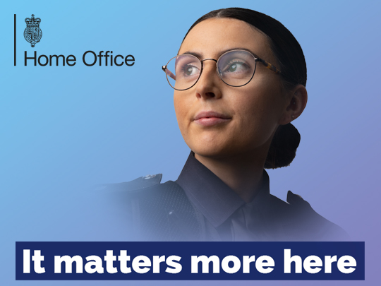 A photo of a woman in a blue uniform, her hair is tied back in a bun. The text reads "It matters more here".